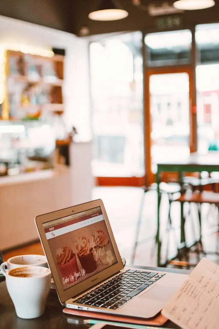 Photo of Laptop Beside White Mug